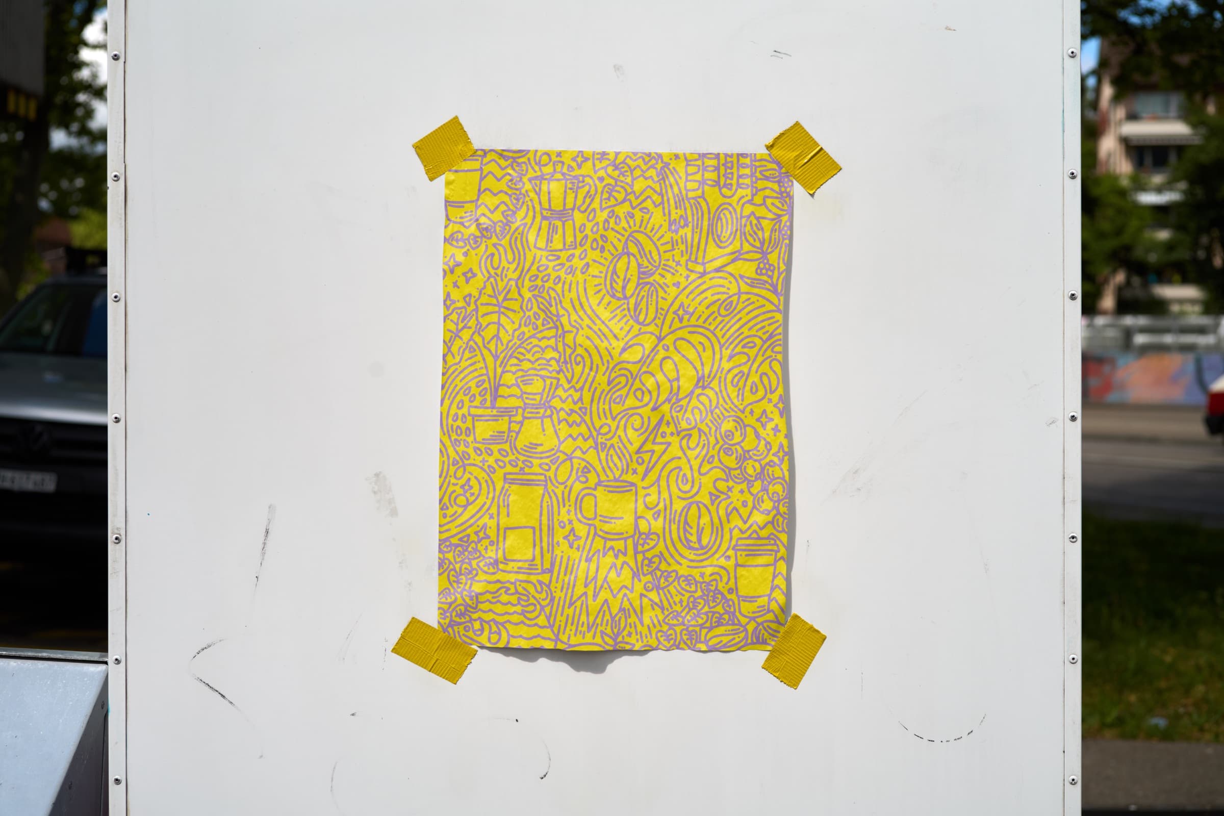 Yellow Verde doodle poster taped to a street wall